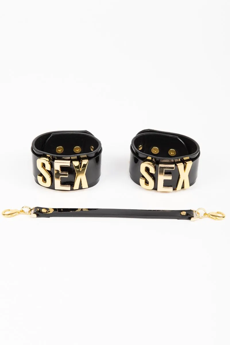 fraulein-kink-gold-letter-handcuffs-fu-fesseln-schwarz-gold image 1